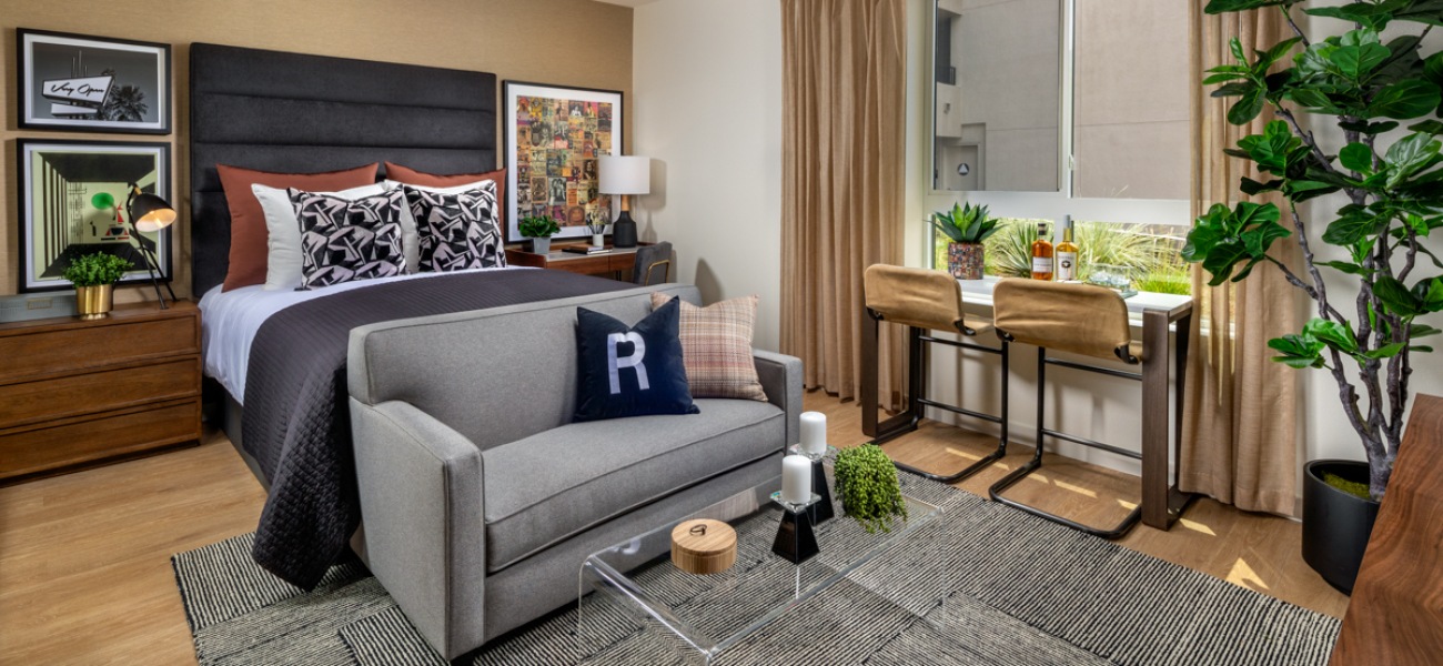 Spacious and well lit studio plan with wood-style floors and large window